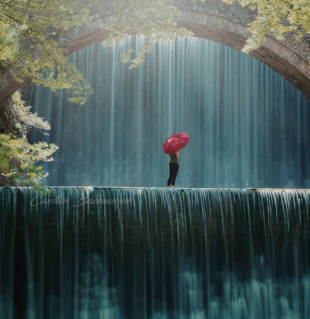 A solitary figure stands beneath a cascading waterfall, holding a vibrant red umbrella, surrounded...
