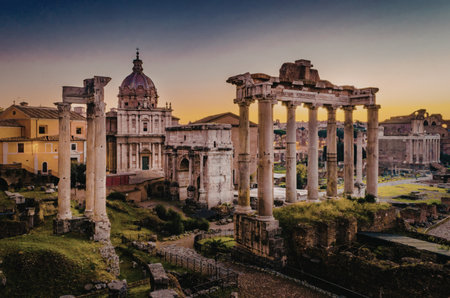 A captivating image of ancient Roman ruins at sunset, featuring tall columns and remnants of historical structures with a backdrop of a domed building and surrounding architecture.の写真素材