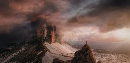 A breathtaking sunset illuminates the snow-covered peaks, casting a warm glow over the rugged...