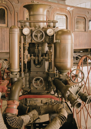 A detailed close-up of a vintage steam locomotive engine, showcasing its intricate mechanical...