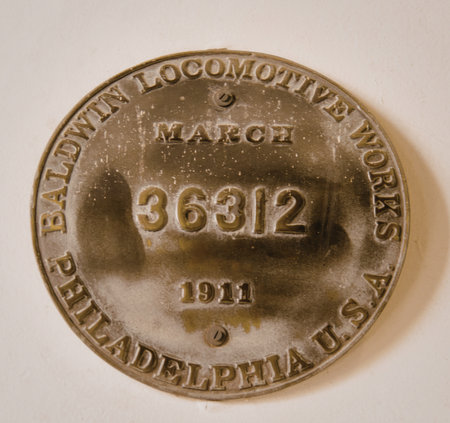 A round metal badge from the Baldwin Locomotive Works, dated March 1911, featuring the number 36312 and the location Philadelphia, USA.の写真素材