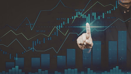 The image depicts a person's hand pointing at a stock market chart, highlighting key data points....