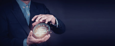 A man in a business suit holds a glowing object, symbolizing global business or technology.の写真素材