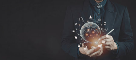 A professional businessman in a suit is holding a digital globe with various security icons...