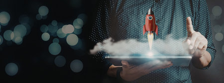 A hand holding a cloud with a small red rocket launching, emphasizing innovation and success.