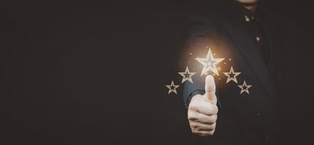 An image of a hand giving a thumbs up, with glowing stars emanating from the fingertip, set against...