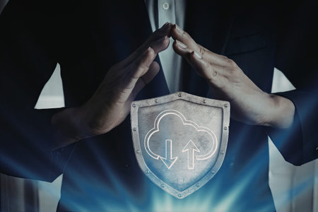 An image of two hands forming a shield with a cloud icon and arrows indicating data transfer.