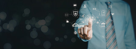 A close-up image of a businessman in a suit and tie interacting with digital security icons that...