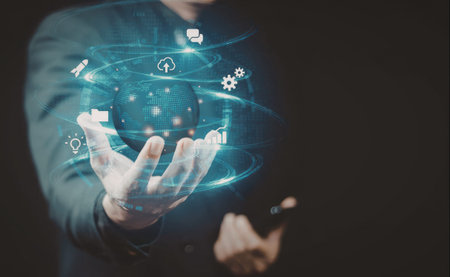 A person is holding a digital globe with various connected icons representing technology and...