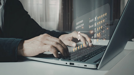 A person is using a laptop to analyze data visualizations, likely for business or research purposes....