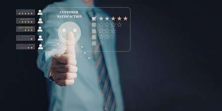 A close-up image of a person giving a thumbs-up gesture, with a digital interface displaying...