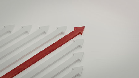 A prominent red arrow stands out, pointing upwards amidst a grid of uniformly arranged white arrows on a plain background. The contrast emphasizes the singular red arrow, symbolizing direction and focus.の写真素材