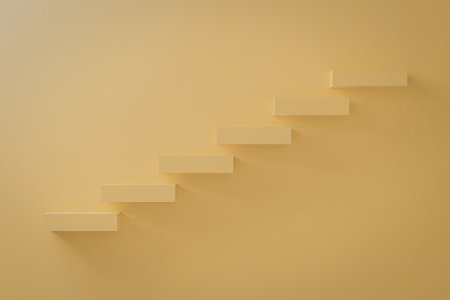 A minimalist image featuring a series of yellow steps ascending diagonally against a solid yellow background.の写真素材