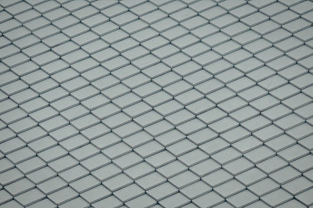 A close-up view of a repeating diamond pattern texture, characterized by intersecting diagonal lines...