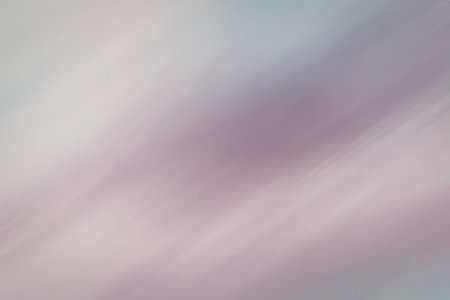 A serene and calming pastel gradient background featuring soft pink and purple hues, ideal for use in design projects requiring a subtle and soothing color scheme.の写真素材
