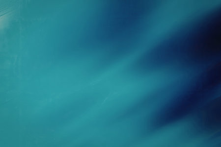 A visually appealing abstract image featuring a gradient of blue hues and a light effect, creating a dynamic and captivating visual experience.の写真素材