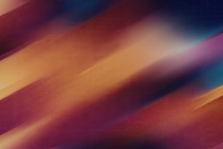 A dynamic abstract background featuring a diagonal gradient with blurred colors, creating a sense of movement and energy.の写真素材