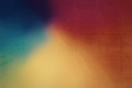 A colorful gradient background featuring a blend of blue, green, yellow, orange, and red hues, creating a vibrant and dynamic visual effect.の写真素材