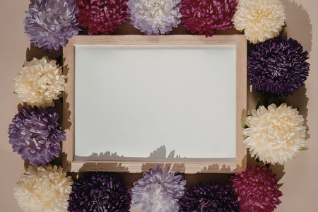 A wooden frame surrounded by colorful flowers on a beige background