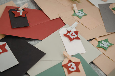 A collection of colorful envelopes with numbered tags, featuring various colors and designs.