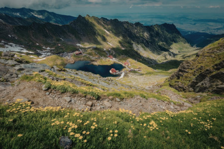 A serene mountainous landscape featuring a lake surrounded by lush greenery and vibrant yellow...