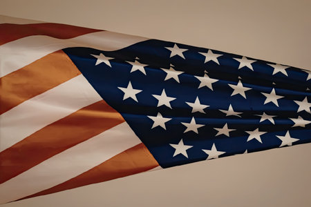 The image depicts a waving American flag with its characteristic red and white stripes and blue rectangle with white stars.の写真素材