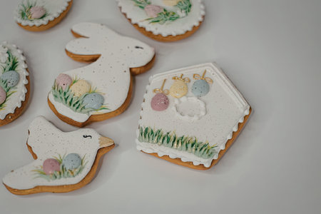 A collection of Easter themed cookies decorated with eggs and grass