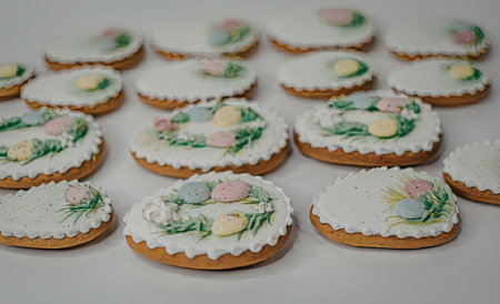 A collection of Easter themed cookies decorated with white icing and colorful eggs