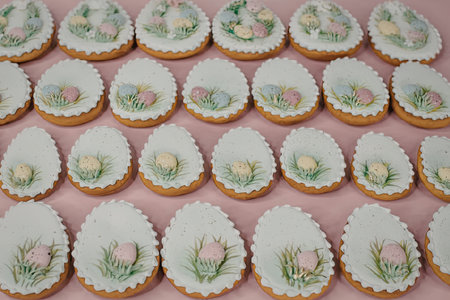 A collection of Easter-themed cookies decorated with floral designs and pastel colors.