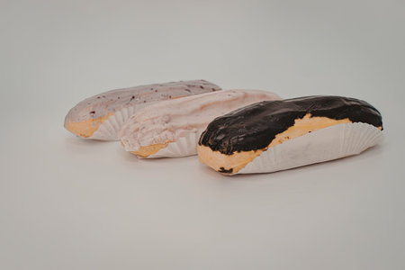 The image features three objects with painted designs on a white surface. The objects are arranged...