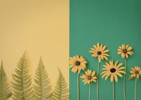 A colorful arrangement featuring yellow flowers and green ferns against a split yellow and green...