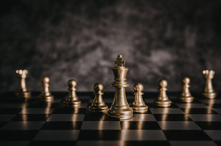 A chessboard with golden chess pieces, including a king, queen, pawns, and others, set against a...