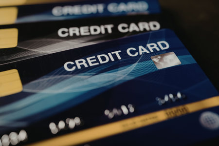 A close-up view of multiple blue credit cards stacked on top of each other.