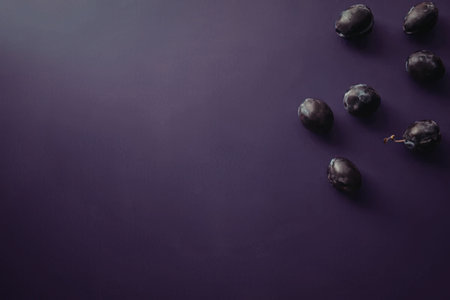 A close-up of blueberries on a purple background