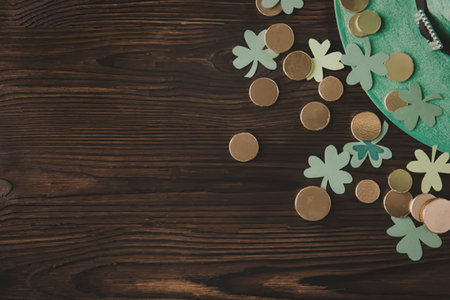A St. Patrick's Day decoration featuring a green plate with gold coins and shamrocks on a dark...