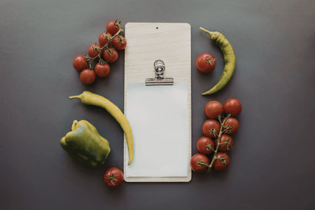 Vibrant vegetables on a dark surfaceの写真素材