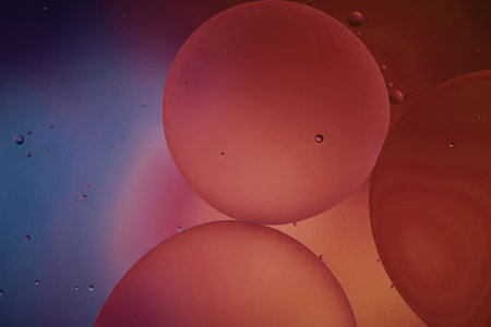 An image of red and purple spheres with a gradient background