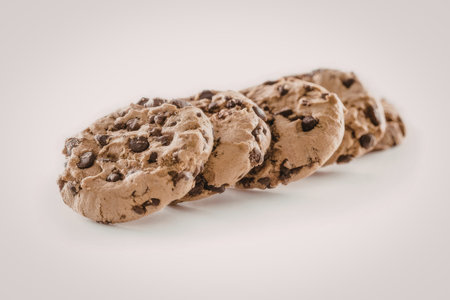 Freshly baked chocolate chip cookies with visible chocolate chips and a soft texture, displayed on a...