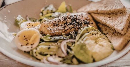 Grilled chicken breast salad with avocado and whole grain bread served on a plate, showcasing a...