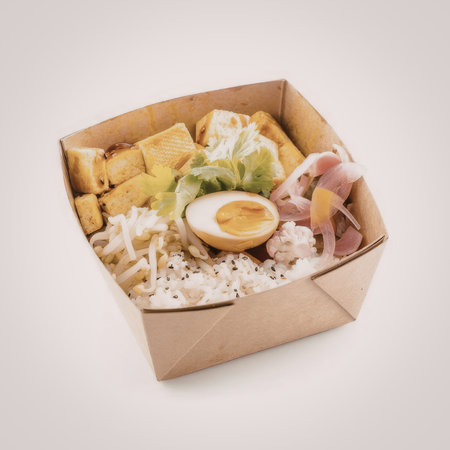 Asian style rice meal topped with grilled tofu, pickled ginger, bean sprouts, and a soft boiled egg...