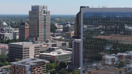 A cityscape showing tall buildings, office towers, and urban scenery.
