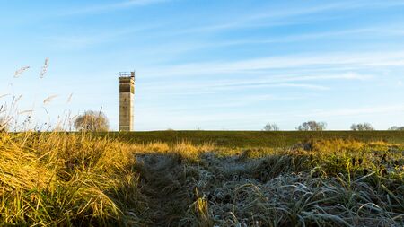old GDR watchtower on a Dykeの写真素材