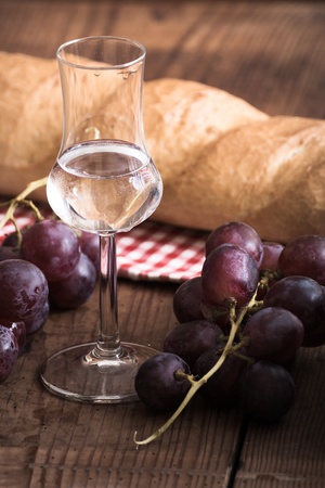 italien Grappa with Grape and Breadの写真素材