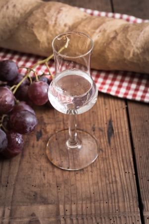 italien Grappa with Grape and Breadの写真素材