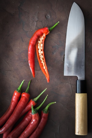 japanese Knife with Chili on old Leatherの写真素材