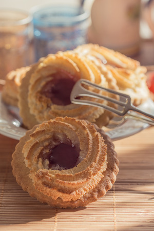 German Ox Eye cookies on a laid tableの写真素材