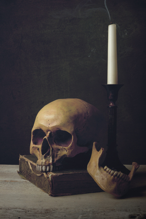 Vanitas with Skull, Candle and Bookの写真素材