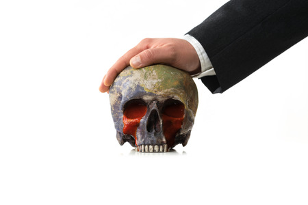 bloody Earth under pressure of a Businessmanの写真素材