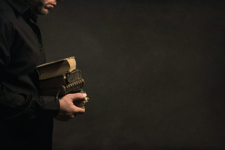 Man holding old Books in his Hands