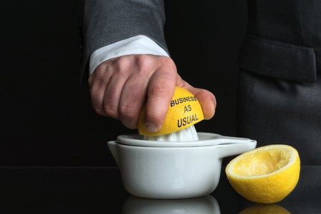 Concept for business as usual with Lemon and a Manの写真素材